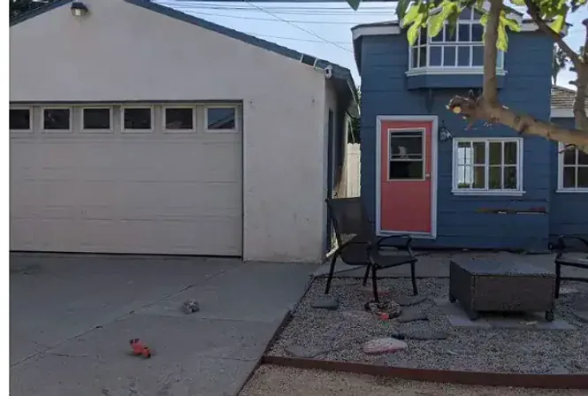 Residential property exterior before demolition and yard cleanup in Santa Fe Springs
