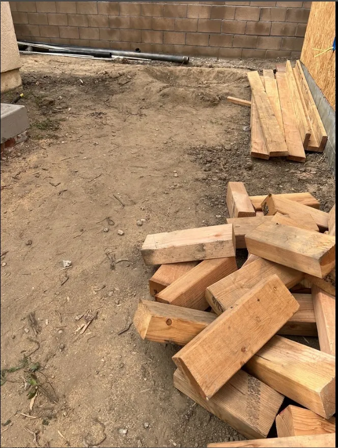 Stacked lumber and wood debris removed from a residential property