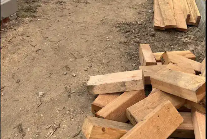 Stacked lumber and wood debris removed from a residential property